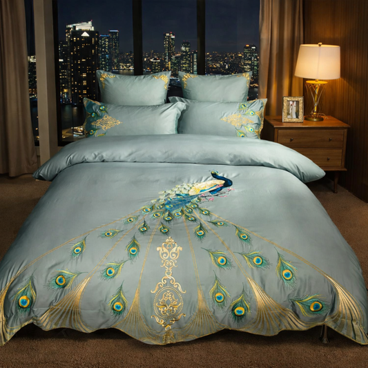 Decorative bedspread with peacock design in a bedroom setting with cityscape view.